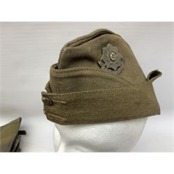 WW2 East Yorkshire Regiment side cap with badge; and quantity of WW2 British Army webbing and leather accessories including three 1940 pairs of gaiters, three webbing belts, five puttees, leather harness and drum stick