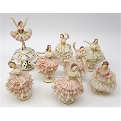  Eight Dresden crinoline Ballerinas, one mounted on pierced musical base, H24cm max (8)  