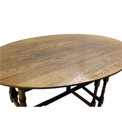 Large 18th century design oak wake or dining table, oval drop-leaf top, turned supports with double gate-leg action base, united by moulded stretchers 
