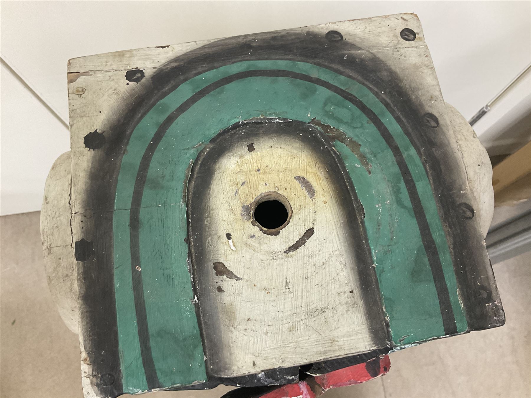 Folk art circus clown cabinet, the the two hinged doors with bow tie decoration opening to reveal fitted shelved interior, the body painted with polka dots and spades, H121cm