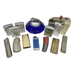 Collection of lighters, including Ronson Varaflame, Zorr Classic, Dunhill bark effect roller gas lighter, and faceted blue glass table lighter, etc