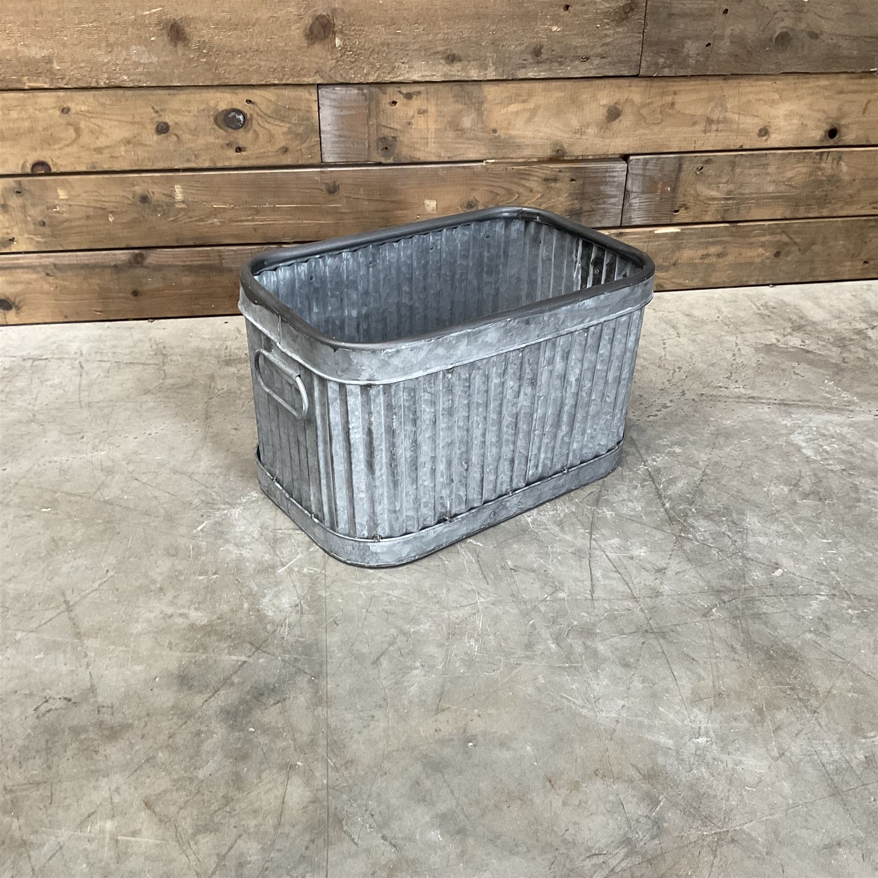 Set of three pressed metal planters in different sizes
