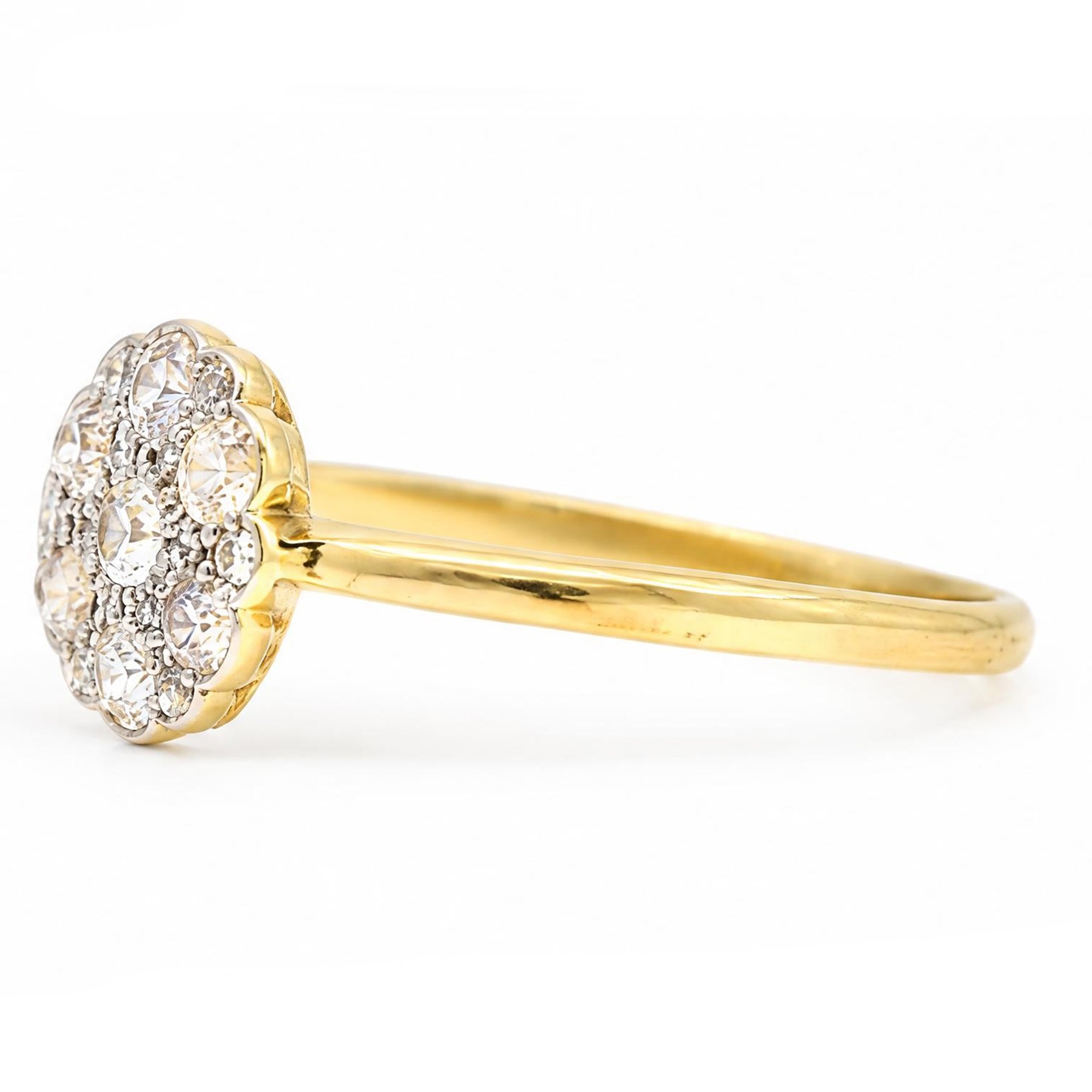 Early 20th century diamond daisy cluster ring, milgrain and bead set with thirteen old cut diamonds by Ahronsberg Brothers, stamped 18ct, total diamond weight approx 0.45 carat