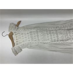 Seven lacework christening gowns