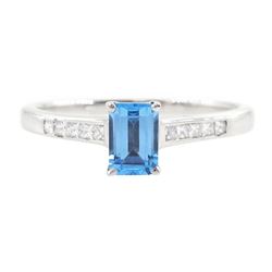 18ct white gold blue topaz and diamond ring, the single emerald cut topaz of approx 0.65 c...