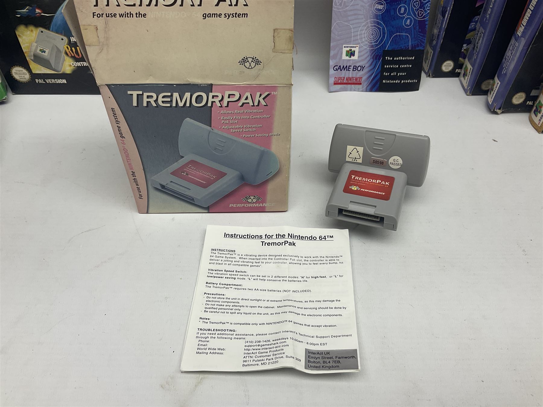 Nintendo 64 console, two controllers, games and accessories. Accessories to include the ‘Tremorpak’ and ‘Spook’ 2 Phono plugs and a S-VHS plug with adapter, both in original boxes. Games to include ‘Golden Eye 007’, ‘Doom 64’, ‘Killer Instinct Gold’, ‘Tetrisphere’, ‘F-1 World Grand Prix’, ‘Pilotwings 64’ and ‘Lylatwars’ with ‘Rumble Pak’, all with original boxes and instruction manuals. ‘Star Wars Episode I Racer’ game cartridge in Shadows of the Empire box. 