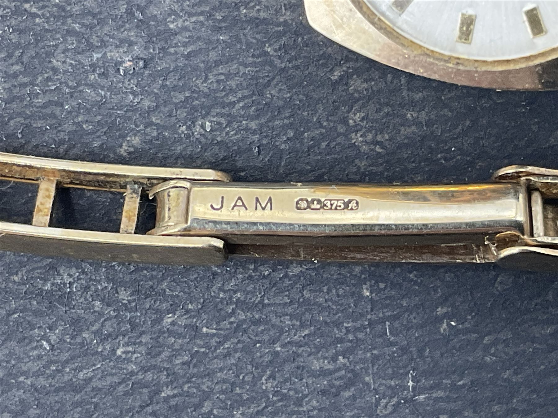 9ct gold Summit 17 Jewels ladies manual wind wristwatch, on 9ct gold articulated strap, stamped 375