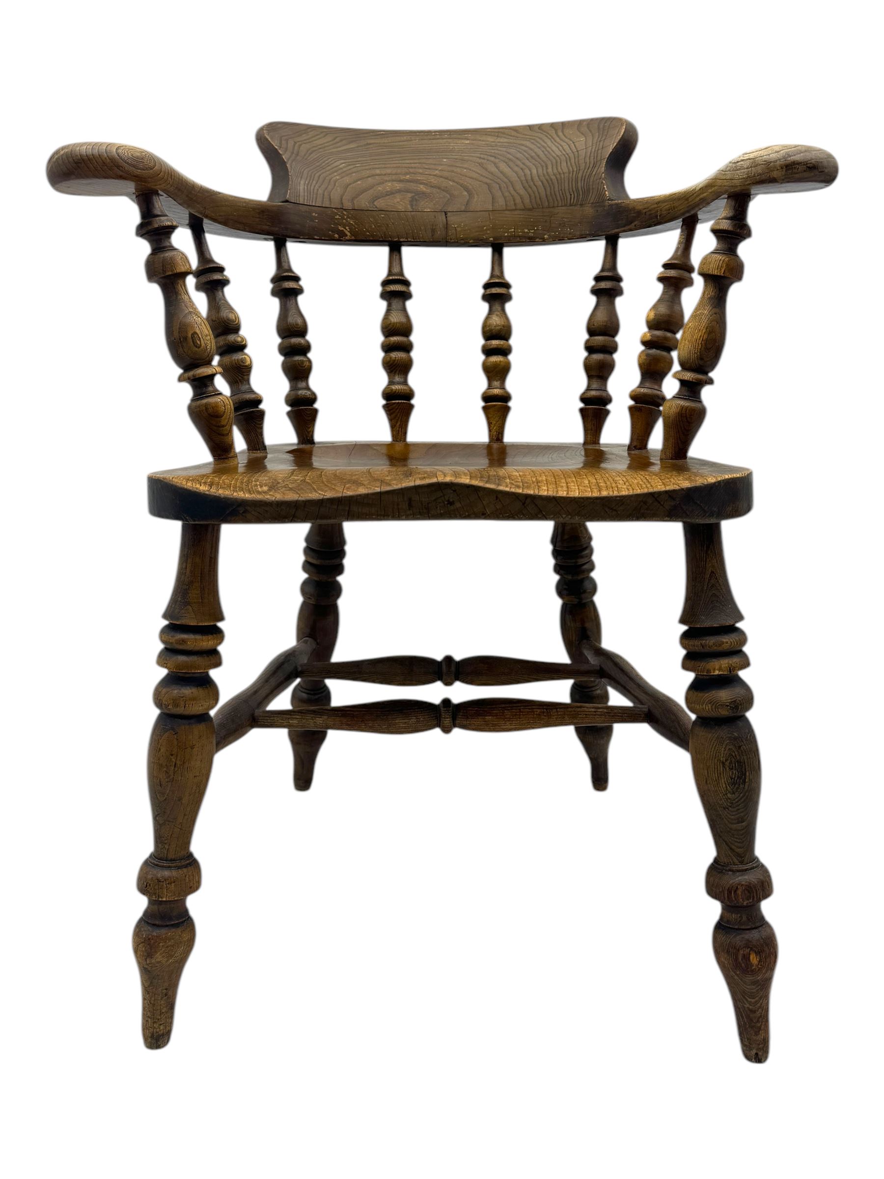 19th century elm and beech smoker's bow armchair, shaped arms over turned spindle gallery and dished seat, on turned supports united by double H-shaped swell turned stretchers 