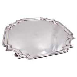 1930's silver salver, of square form with shaped and canted edge, upon four scroll feet, hallmarked Mappin & Webb Ltd, Sheffield 1931, D34.5cm, approximate weight 48.02 ozt (1493.7 grams)
