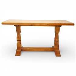 Sid Pollard of Thirsk - Yorkshire oak coffee table, rectangular adzed top with softly moulded edge, raised on twin octagonal baluster supports, united by a plain stretcher, on shaped splayed feet