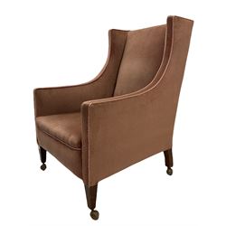 Edwardian wingback armchair, on square tapering supports