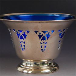 American silver sugar bowl, of circular form with fluted rim and fluted sides, upon stepped circular foot, stamped Sterling by Roden, with blue glass liner