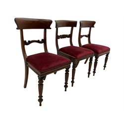 Seven early 19th century mahogany dining chairs - set six side chairs with scroll carved middle rails (W46cm), and a carver elbow chair with rope twist middle rail