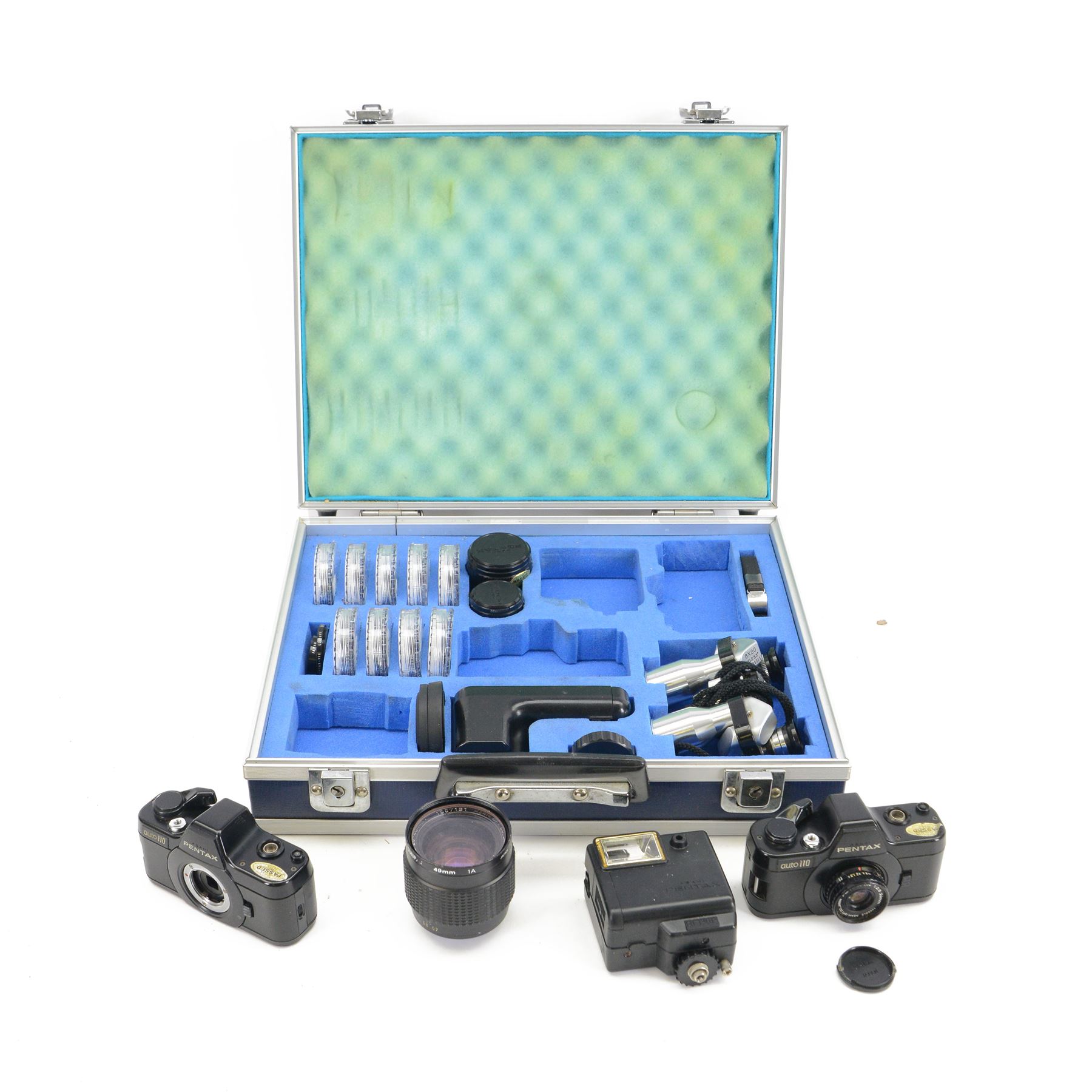 Pentax Auto 110 camera outfit, comprising two camera bodies, serial nos. 2055664 & 1062072, Pentax-110 1:2.8 18mm lens serial no. 1363262, Pentax-110 1:2.8 50mm lens serial no. 1345010, Pentax-110 Zoom 1:2.8 20-40mm lens serial no. 1007131, winder serial no. 450034 and flash no. AF130P, collection of filters and a pair of Perl 8x20 field binoculars, all housed within a flight case