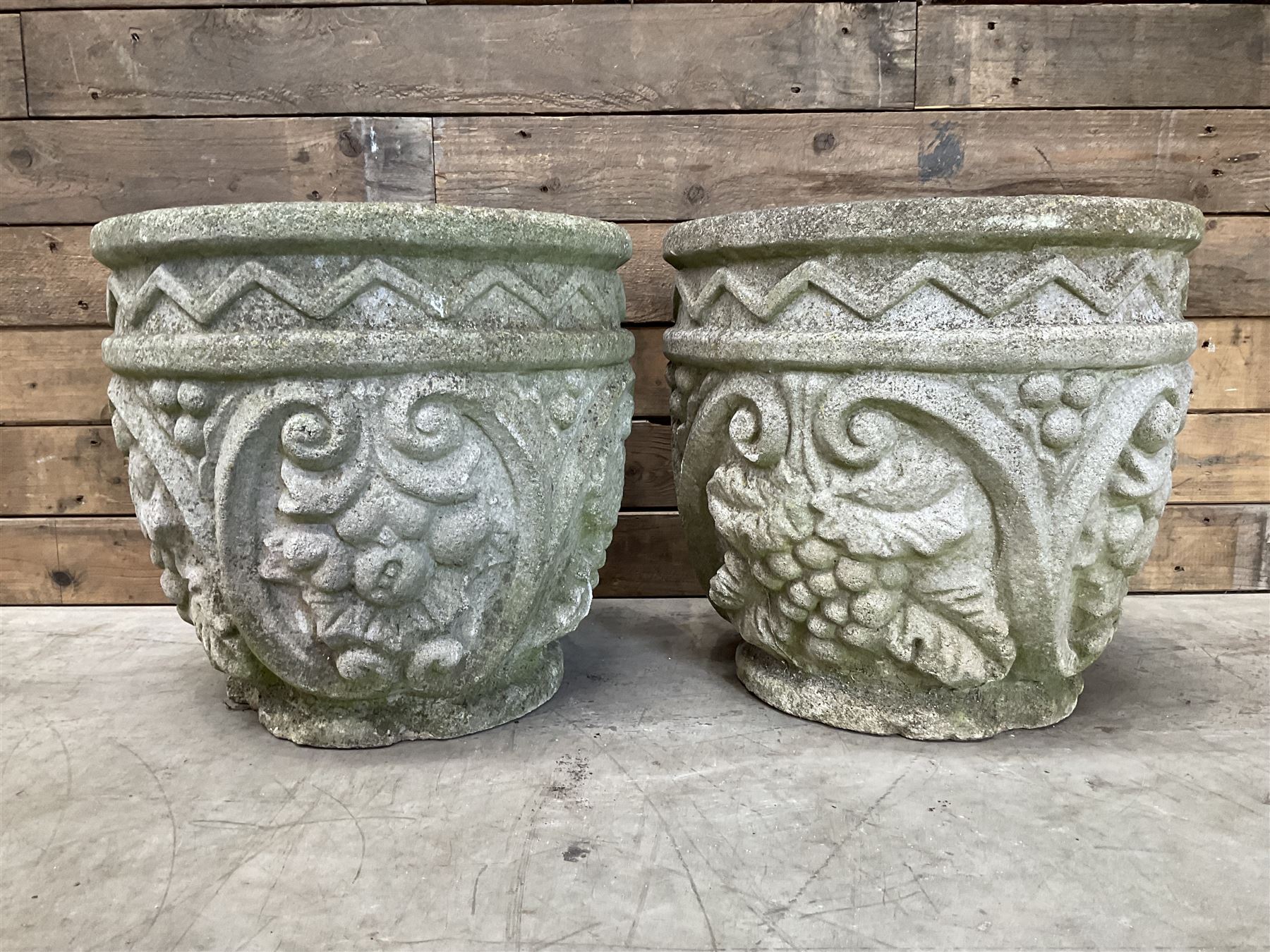Pair of cast stone ornate circular planters