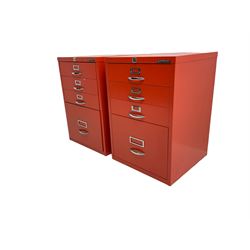 Two red finish 'Bisley' four drawer filing cabinet
