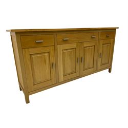 G-Plan - light oak sideboard, fitted with three drawers and four panelled cupboards
