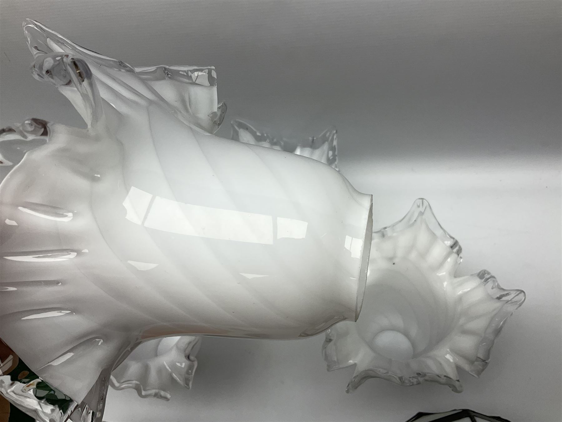 Milk glass lampshade decorated with peacocks, together with a Tiffany style lampshade, a set of five white frilled lamps shades etc 