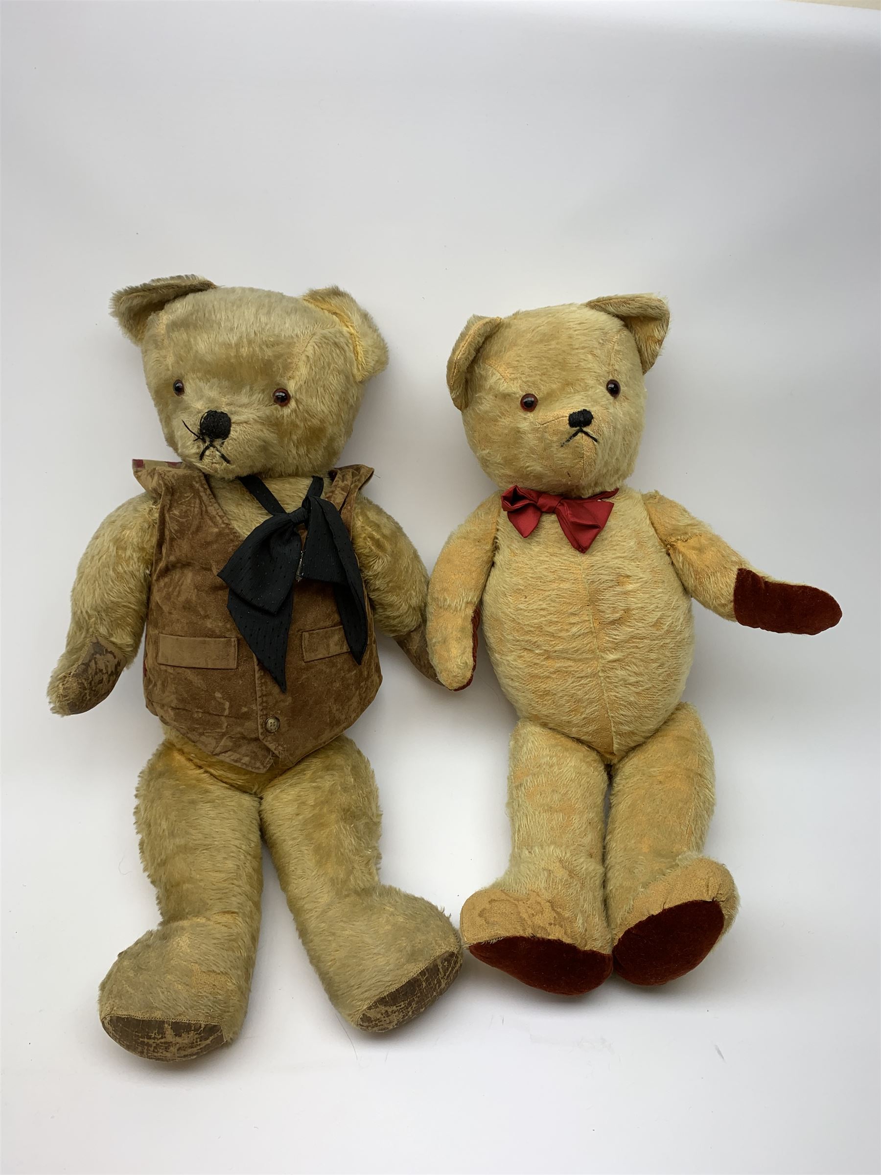 1950s English large wood wool filled teddy bear with swivel jointed head, glass type eyes and vertically stitched nose and mouth and jointed limbs with rexine paw pads H33