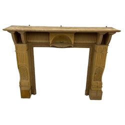 19th century stripped walnut architectural fire surround, curved ribbed frieze with centre shell motif, carved columns, egg and dart inset border