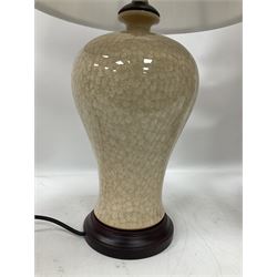 Pair of table lamps of baluster form, decorated in a mosaic pattern in a pale apricot glaze, upon a circular base, including shade H65cm