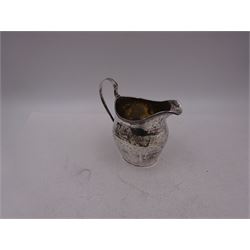 George III silver cream jug, of helmet form, with C scroll handle and a band of engraved strapwork decoration and monogrammed initials to body, hallmarked London 1802, maker's mark SA probably Stephen Adams I, including handle H10.4cm