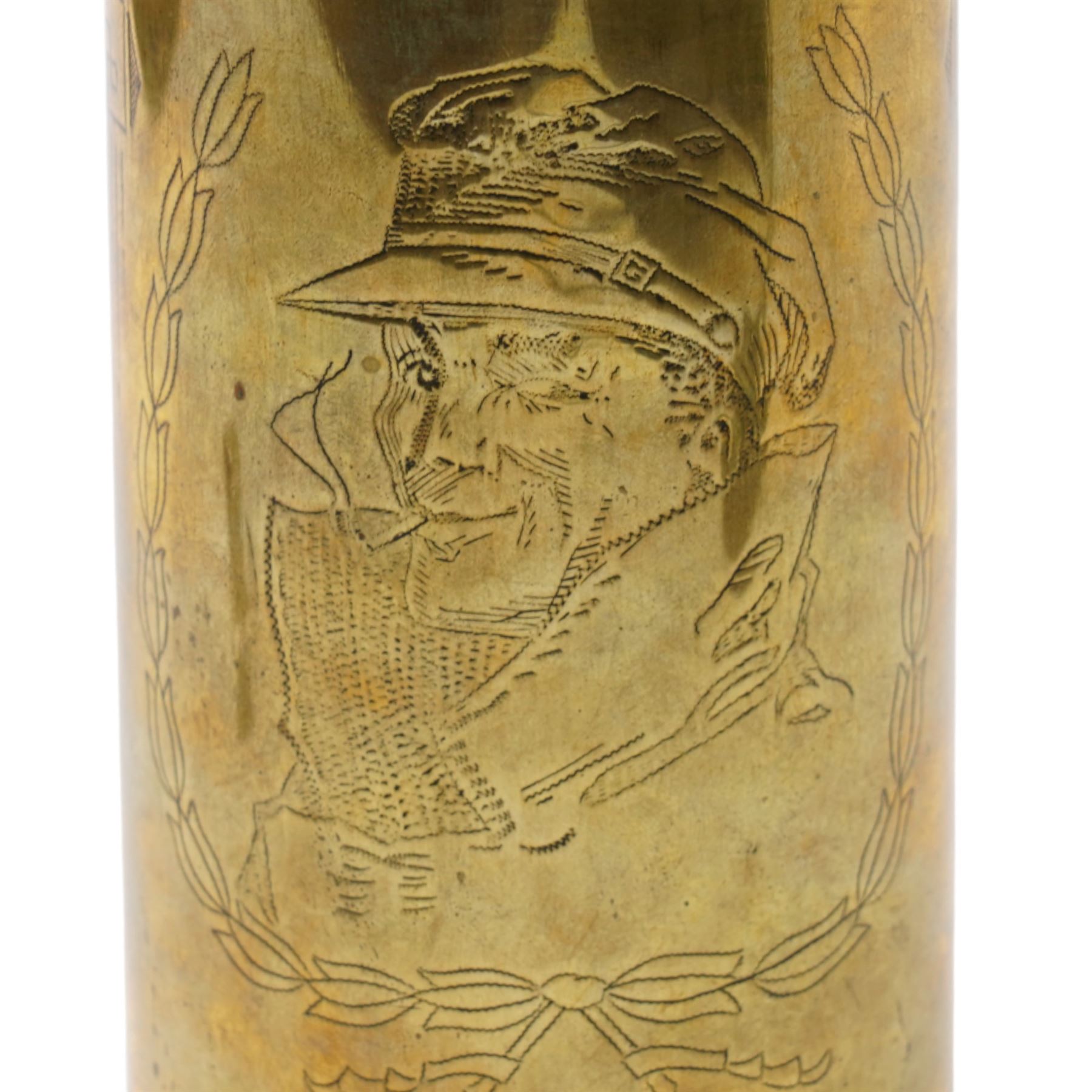First World War trench art shell casing, decorated with crest for The Kings Own Royal Lancaster Regiment, one side decorated with detailed portrait; together with Two Victorian Brass finger plates together with a brass badger and a saussurite model of a pig