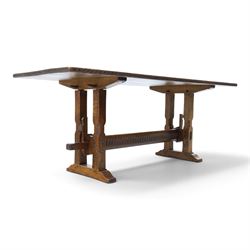 Rupert Griffiths for Monastic Woodcraft - oak 6ft refectory dining table with set six (4+2) matching chairs, rectangular top with arcaded frieze, with trestle base with further arcaded carved stretchers, chairs with carved rails and finials, leather wrapped seats with stud detail, turned supports united by carved stretcher
