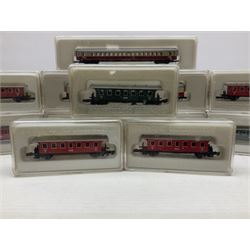Marklin mini-club 'Z' gauge - twelve passenger coaches nos.8610, two 8611, 8613, 8700, two 8701, 8720, 8721, 8722, 8723 and 8725; together with four others in two unassociated boxes; all in hard plastic boxes (16)