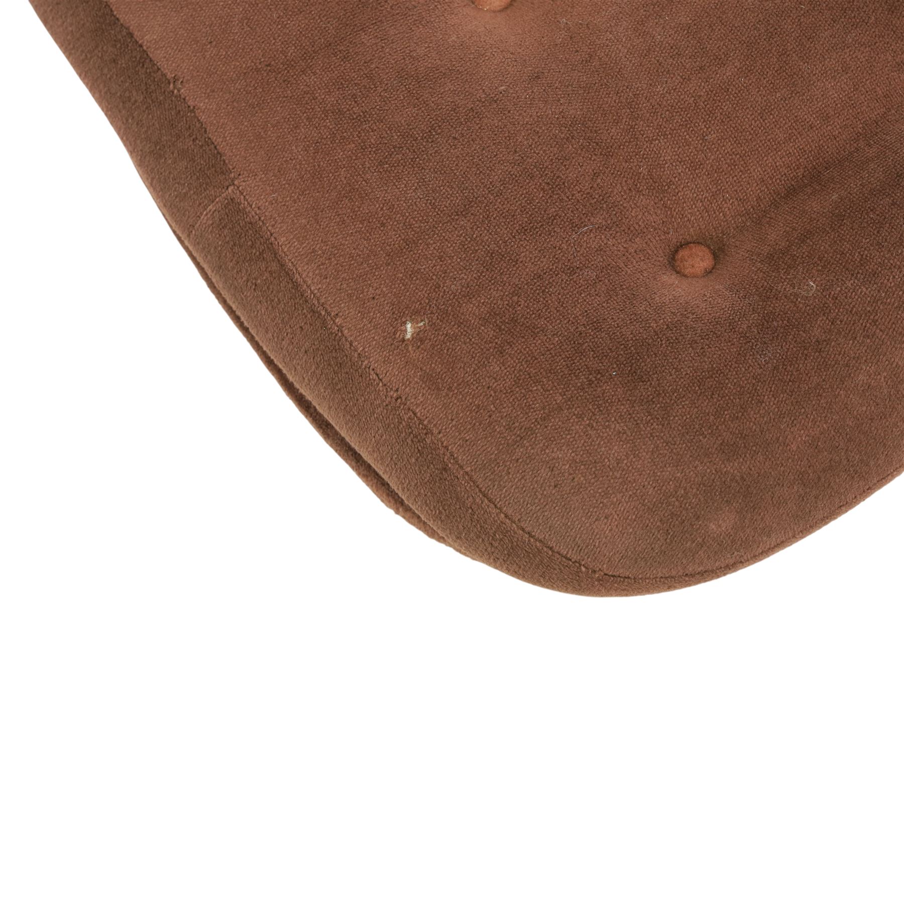 Pair of mid 20th century brown velvet swivel lounge chairs and matching footstool, the shaped and padded back with buttoned segmented cushion over conforming seat cushion, flared armrests and moulded sides, raised on a five point metal swivel base, the footstool en suite with buttoned cushion and matching metal base