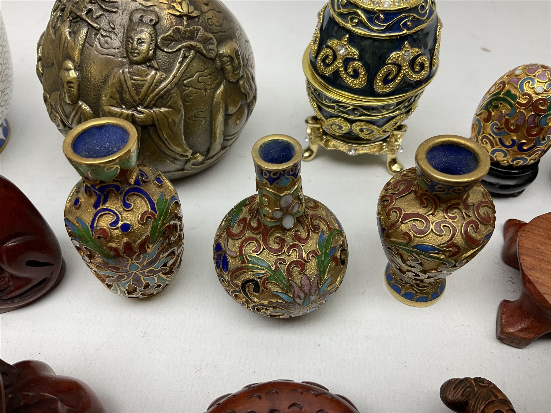 Chinese bronze peach of immortality and longevity, cloisonné vase of baluster form and three miniature cloisonné vases, six Netsuke modelled as monkeys, dragon etc