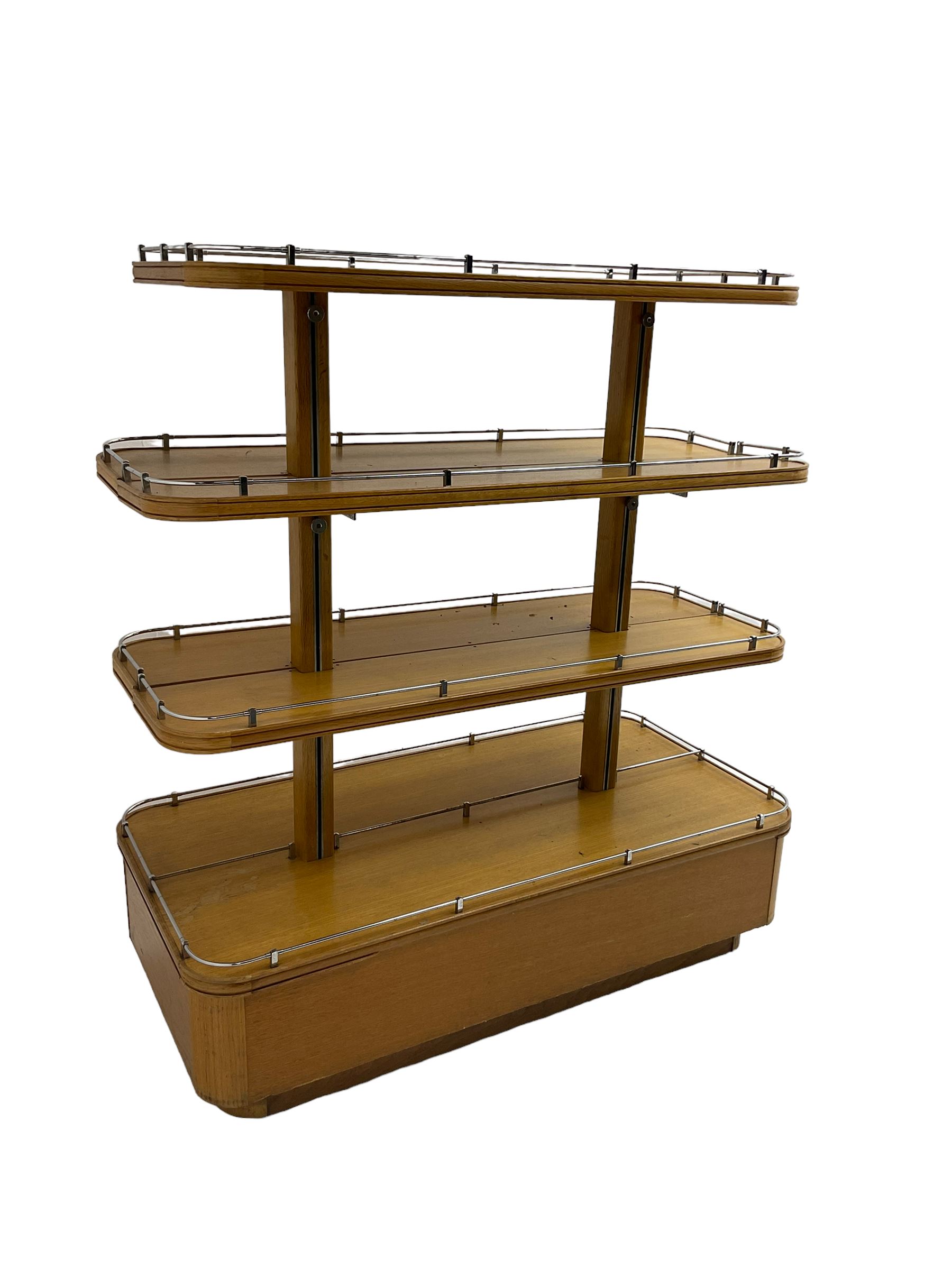 Early to mid-20th century Art Deco design oak shop display stand, fitted with four tiers, the middle two adjustable, with chrome gallery 