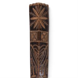 19th century stay busk, of typical triangular form carved with hearts and stylised flowers, with two carving of birds to the verso, L29cm
