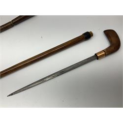 Leather covered swagger/sword stick with 40cm steel blade L62cm overall; another ash sword stick with 30cm diamond section steel blade; pair of fencing foils, the blades marked Solingen; two reproduction flintlock pistols; and 92cm inert cartridge belt (7)