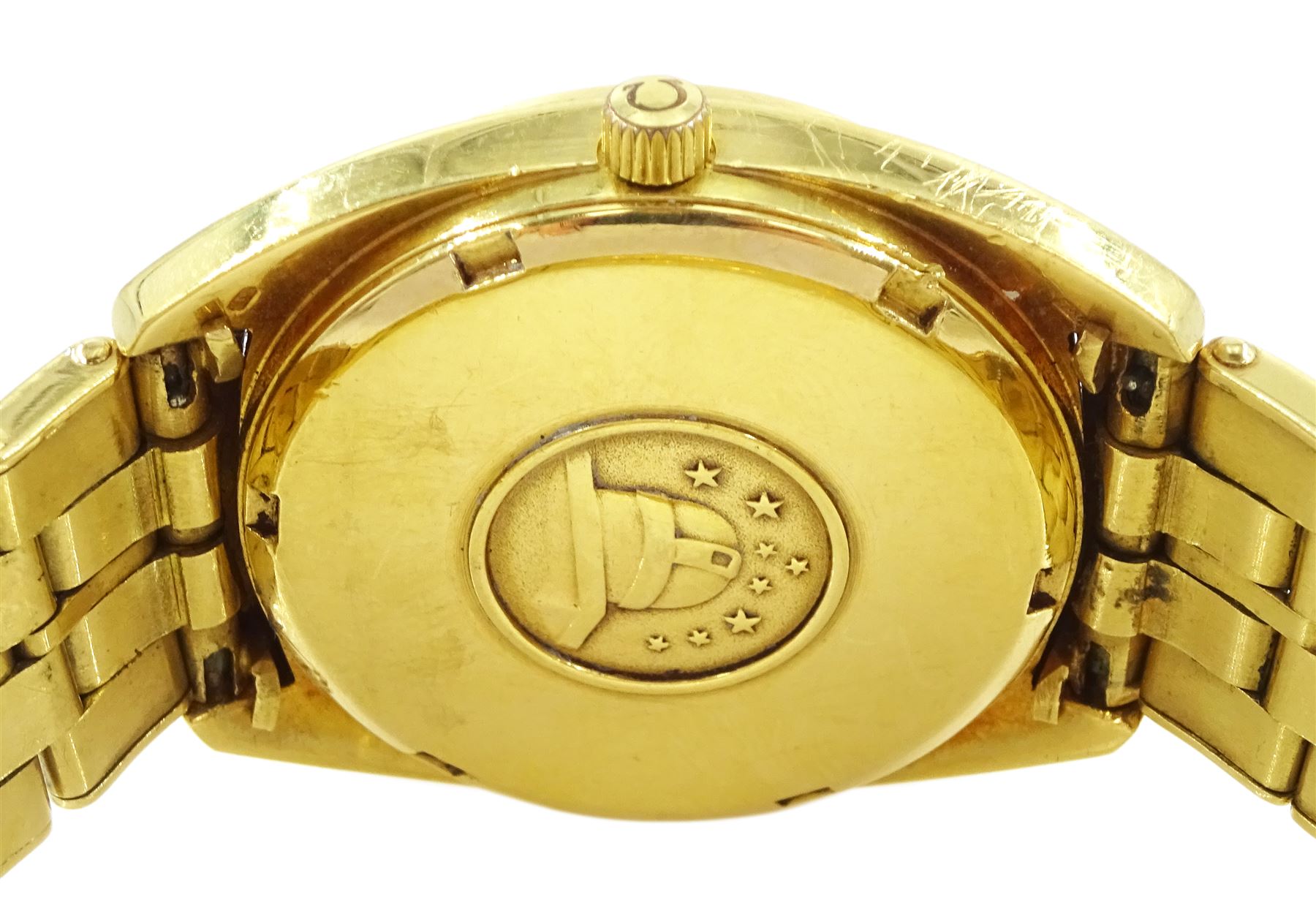 Omega Constellation gentleman's 18ct gold chronometer automatic wristwatch, Ref. 168.0057, Cal 1021, champagne dial with day / date aperture and baton hour markers, stamped 750 with Helvetia hallmark, on original 18ct gold expanding bracelet, with fold-over clasp, London import mark 1973