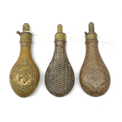 Three Victorian G. & J.W. Hawksley Sheffield brass and copper powder flasks, one embossed with horse's heads in a scrolling cartouche, the other two with differing  basketwork designs, each H21cm (3)