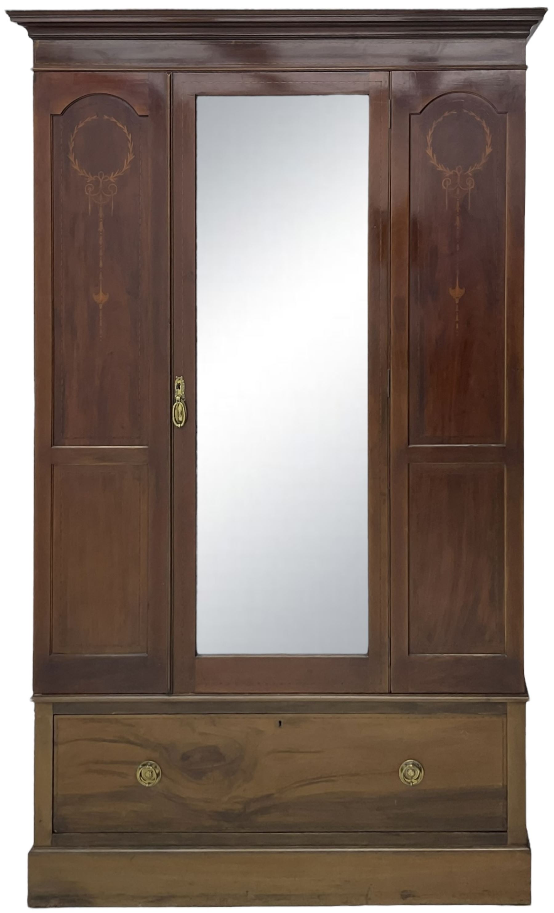 Edwardian inlaid mahogany wardrobe, projecting moulded cornice over central bevelled mirror glazed door, panelled uprights inlaid with trailing bellflowers and foliate decoration, the skirted base fitted with single drawer 