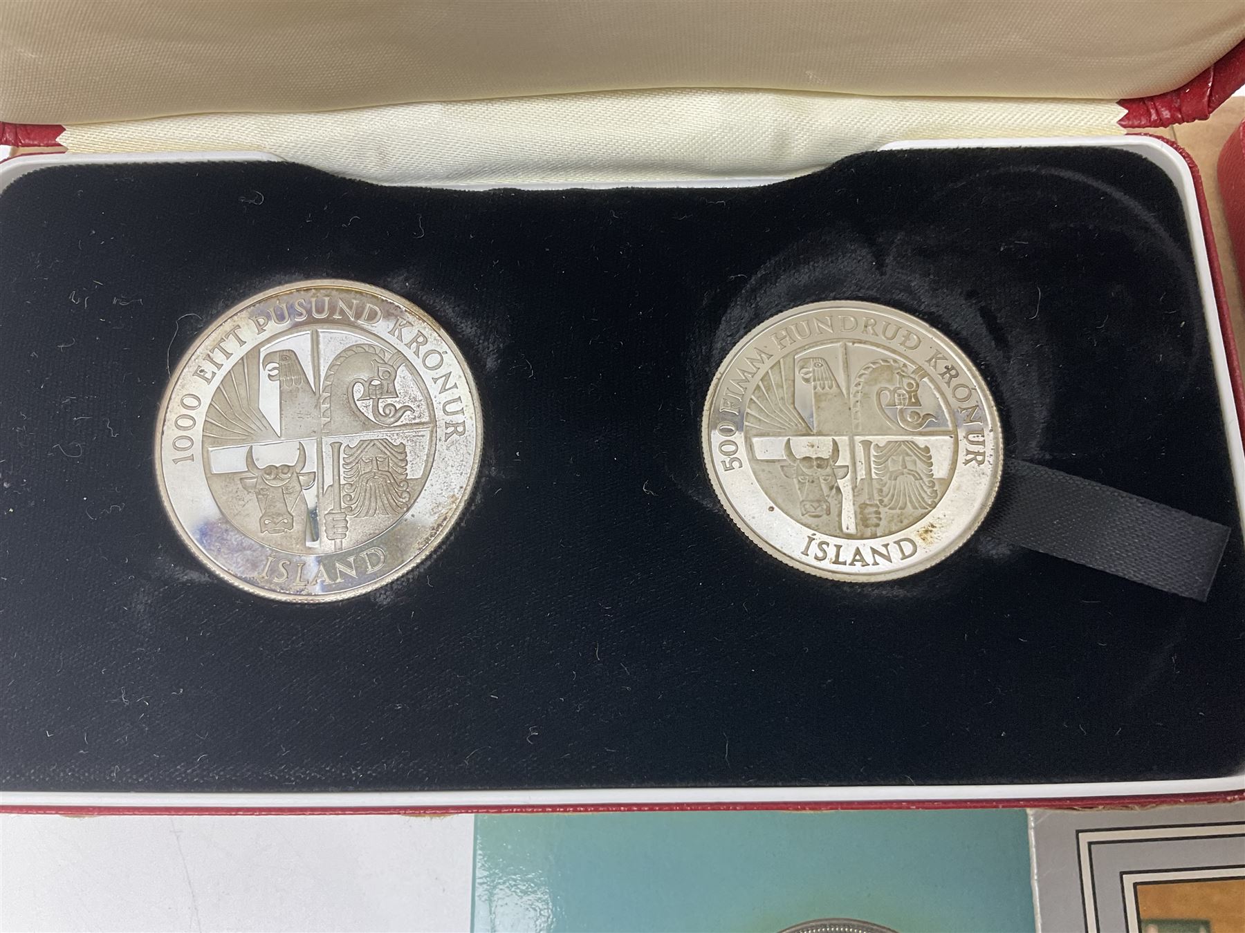 Coins including two King George VI 1951 Festival of Britain crowns each in green case, various other commemorative crowns, two Iceland '874-1974' two coin sets both in original red cases etc