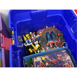 Lego - large quantity of part-built models and loose component parts including Lego Technic and Lego System, space and road vehicles, ships and boats, helicopter etc; together with two set boxes and folder  containing large quantity of instruction booklets; stored in two very large plastic boxes