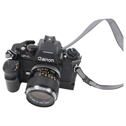 Canon F1 camera body, serial no. 223511, with 'Canon FD 35mm 1:2 FD' lens, serial no.23164, shoulder strap and Canon AE Power winder, serial no.174705