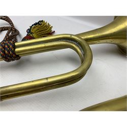 Two military brass bugles by Mayers and Harrison Ltd. Manchester each with crows foot mark and dated 1966; both with multi-coloured cord and tassels, longest 52.5cm (2)