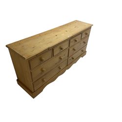Pine multi-drawer unit, fitted with four short and four long drawers, on shaped plinth base