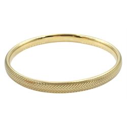 Gold bangle, engine turned decoration, possibly by Deakin & Francis Ltd, stamped 9ct, approx 13.4gm