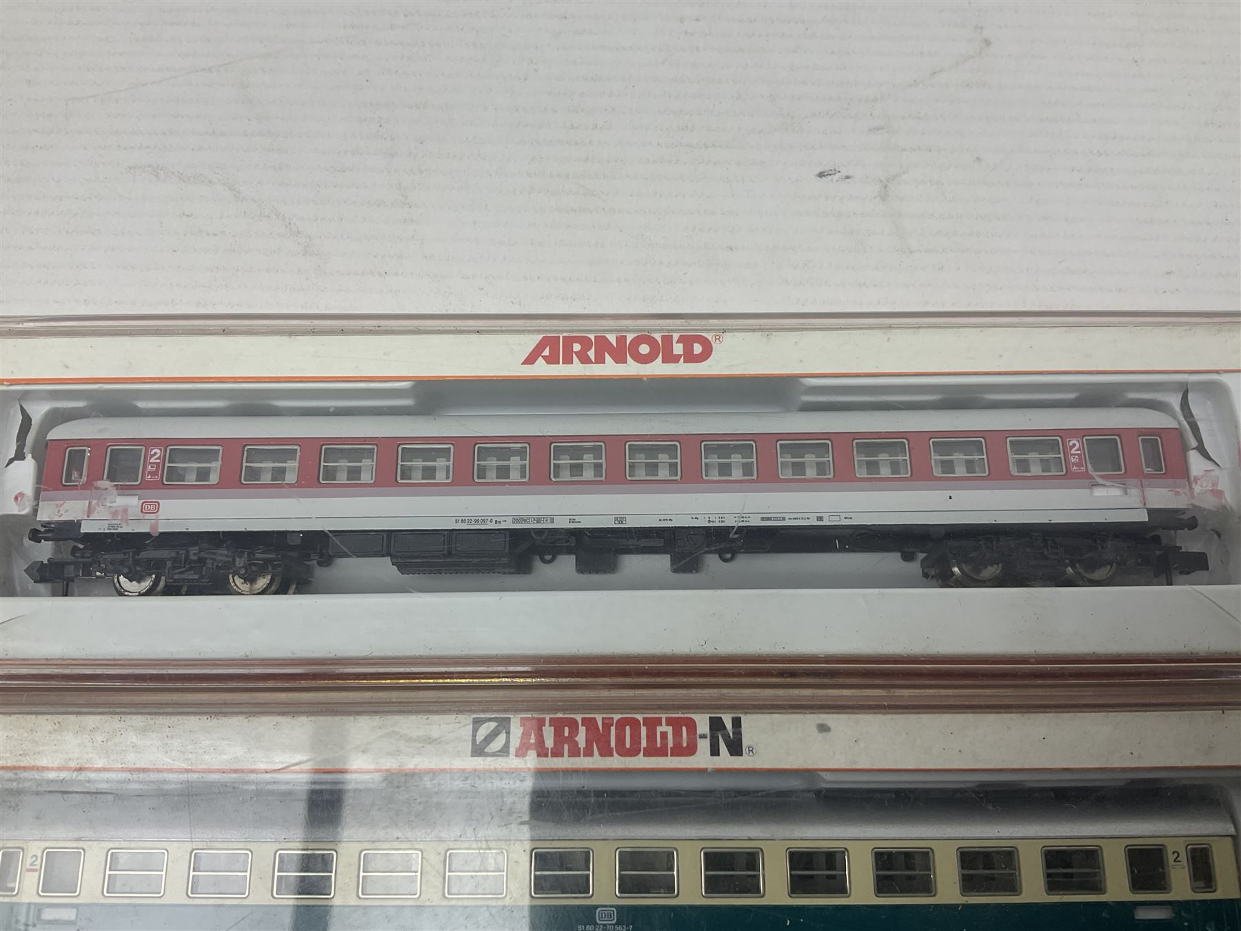 Roco 'N' gauge - 23259 BR 290 German Diesel locomotive and 25307 flat wagon with two containers; both boxed; and two Arnold 'N' gauge passenger coaches Nos.3202 and 3825; both boxed (4)