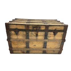 Early 20th century wooden and metal bound trunk, with leather carrying handles 