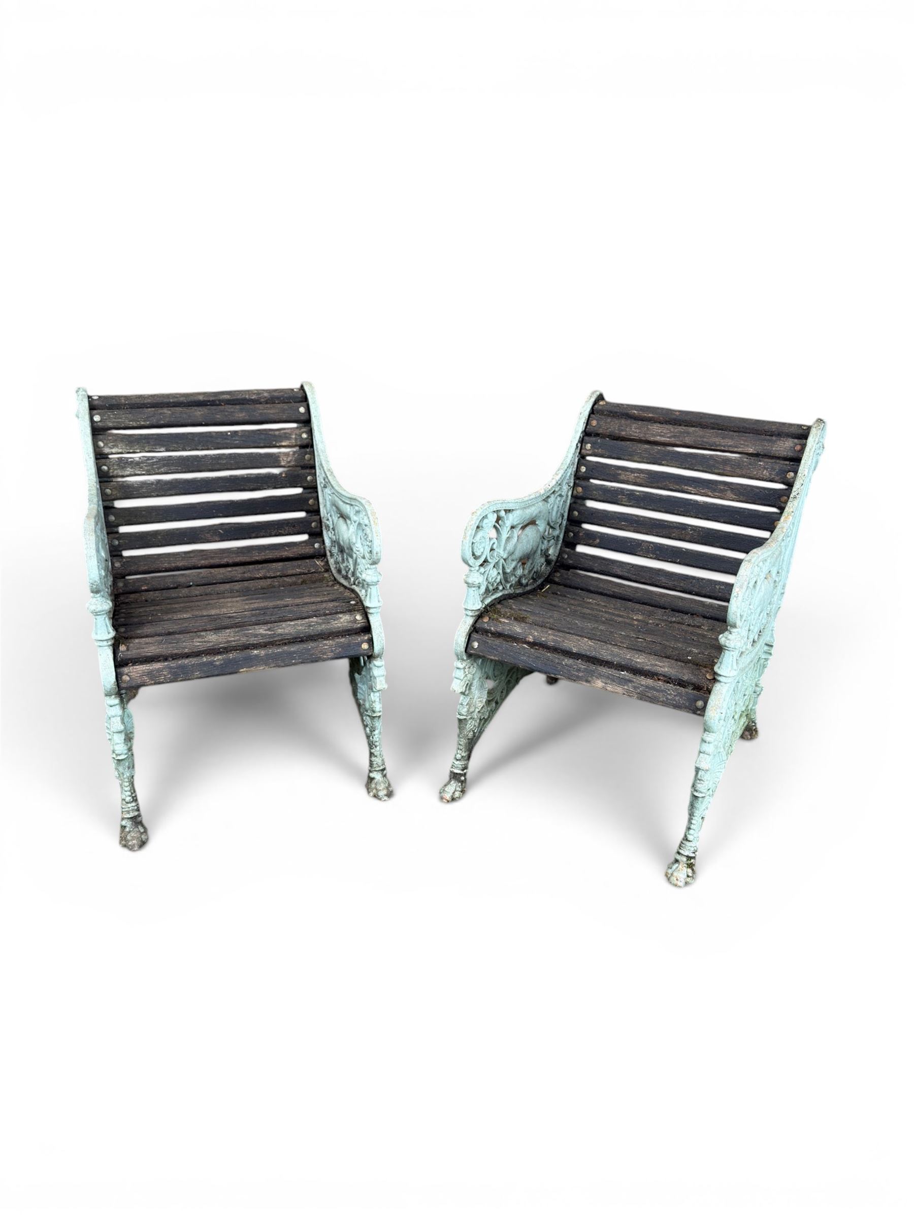 Pair of unusual Victorian revival heavy cast iron garden chair benches, ornate scrollwork detail with squirrels and nature, serpentine wood slatted seat and back - design by George Smith at the Sun Foundry, Glasgow