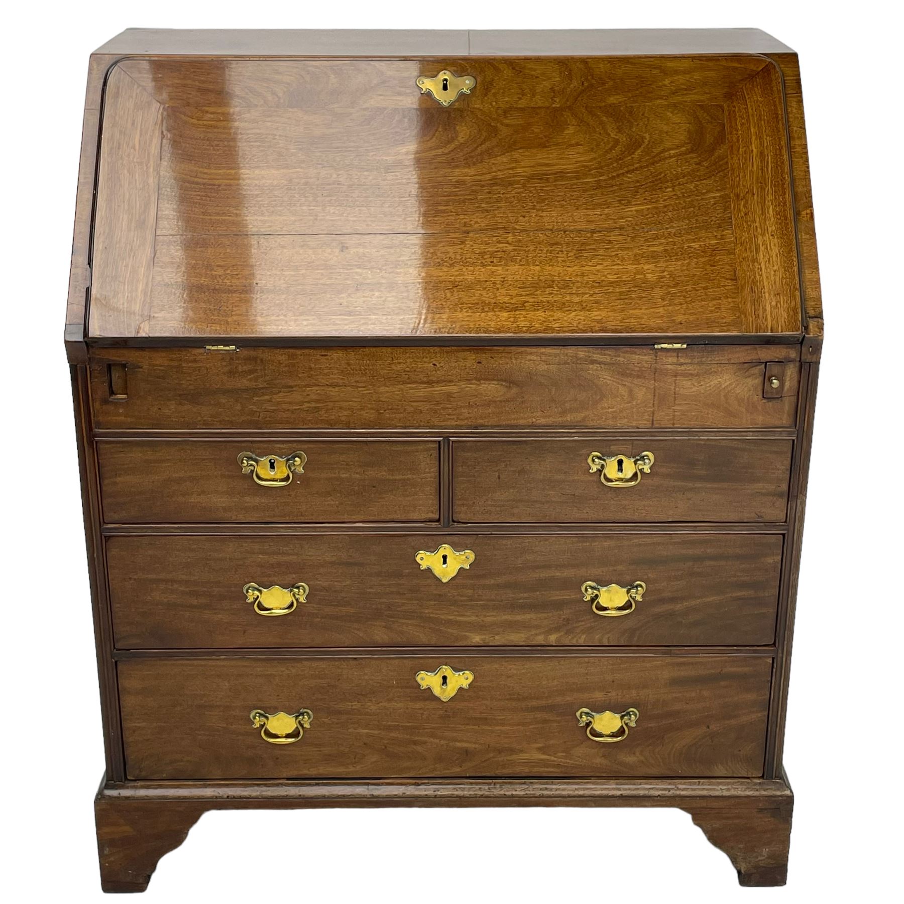 Georgian red walnut and mahogany bureau, moulded rectangular fall front with rounded upper corners, the interior fitted with sliding storage well, a combination of small drawers and pigeons holes, two short and two long drawers below, on bracket feet