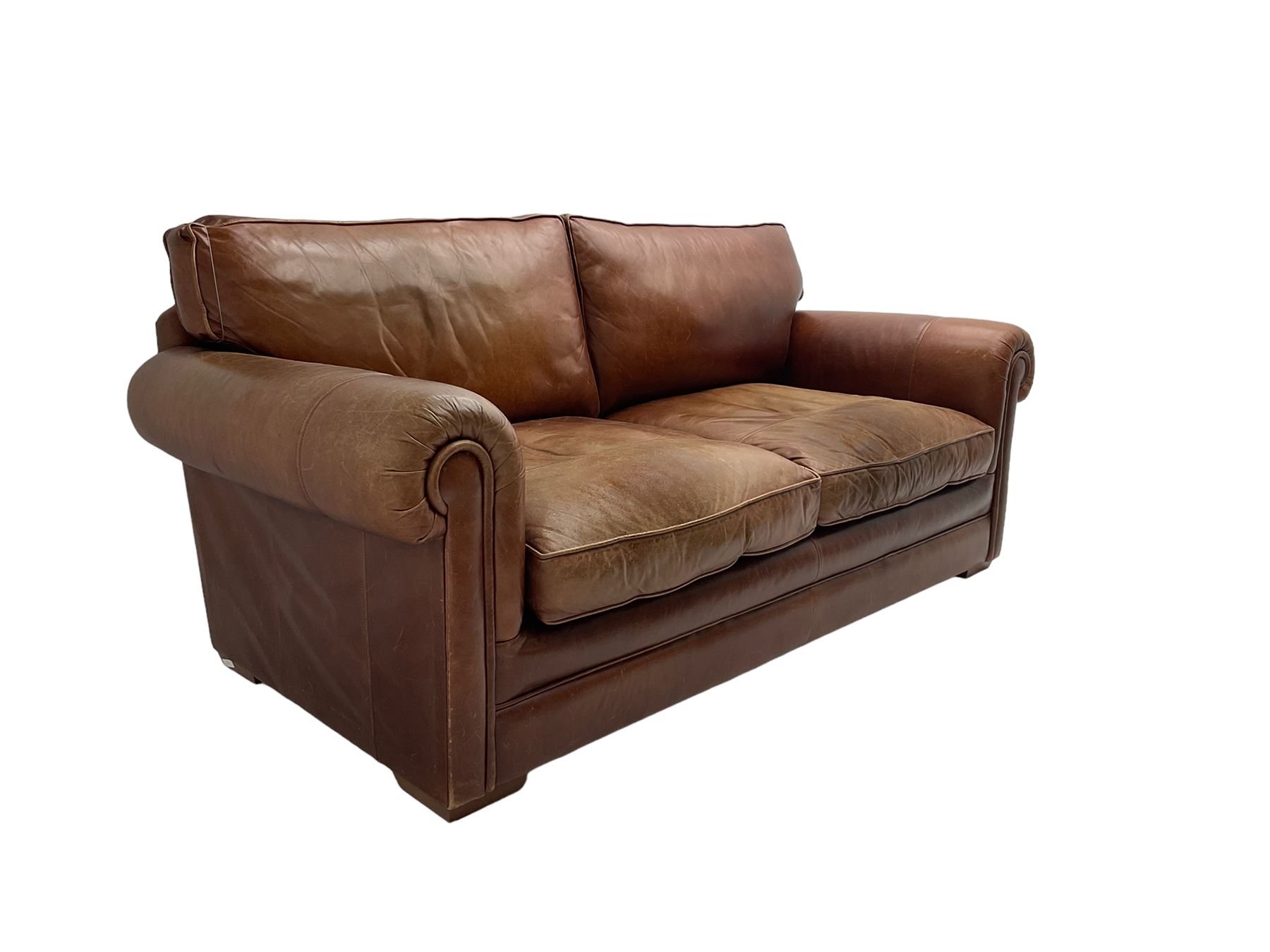 Large two seat sofa upholstered in tan 'Derwent' leather (W200cm D100cm H85cm), and matching armchair (W95cm)