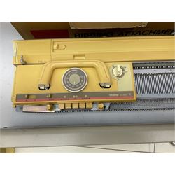  Brother cased knitting machine model KH-890 together with Brother Ribbing attachment model KH-850, knitting machine yarn cones in assorted colours, selection of knitting patterns etc