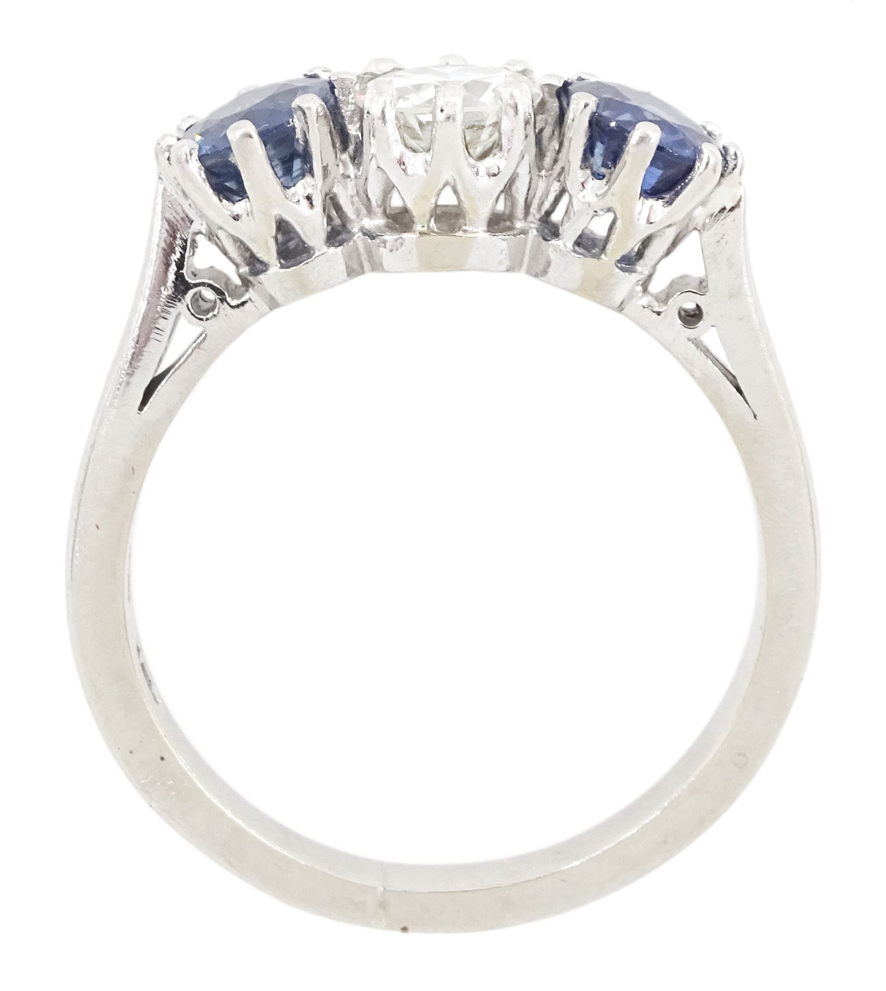 Platinum three stone round cut diamond and cornflower blue sapphire ring, Birmingham 1995, diamond approx 0.50 carat, total sapphire weight approx 1.15 carat